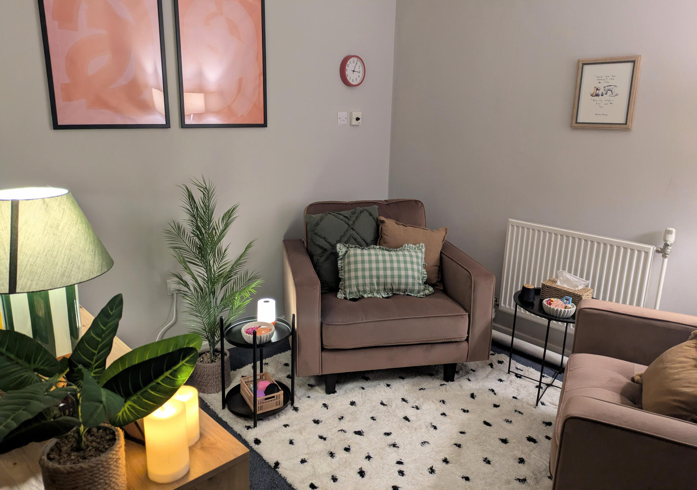 Counselling Room based in Burslem ST6. Image shows two large chairs sat opposite each other with lots of plants and dimmed lighting and candles. Counselling office based in Burslem ST6.